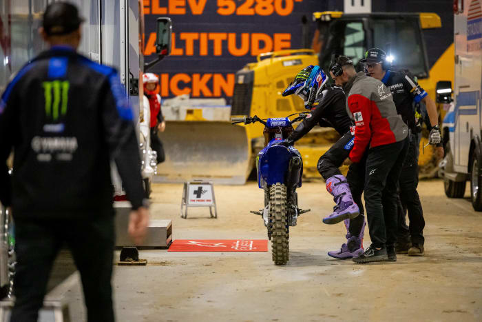 Eli Tomac is helped by medical personnel after being injured in Saturday's Supercross race in Denver. Photo courtesy Feld Motor Sports.